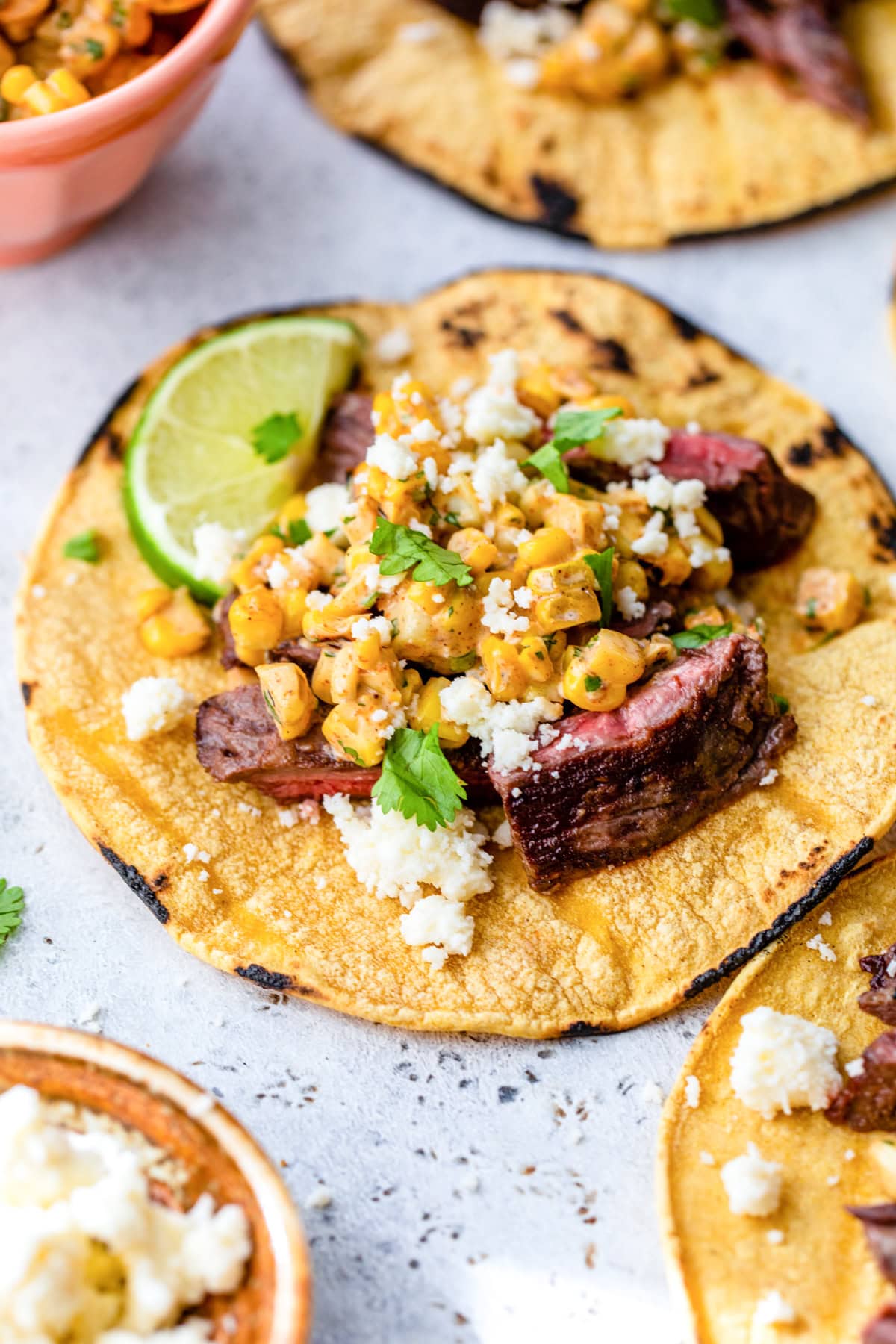 Grilled Skirt Steak tacos with corn and lime
