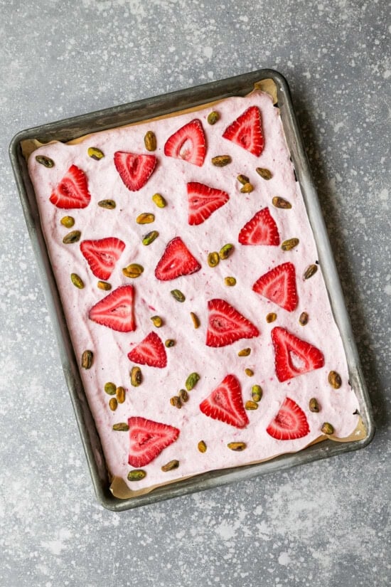 Frozen Strawberry Yogurt Bark on a sheet pan