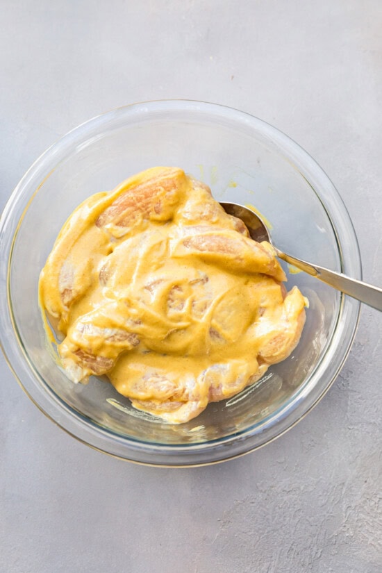 dredging chicken tenders in honey mustard and egg.