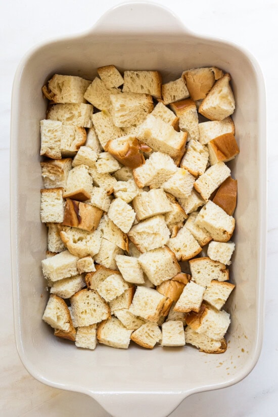 Cubes of bread in casserole dish