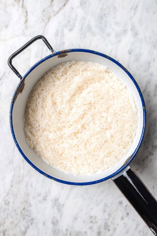 Jasmine rice is a fragrant rice perfect for pairing with curries and stir fries! Make it in the Instant Pot and it's easy, fluffy, and tasty. Rinsed rice in pan
