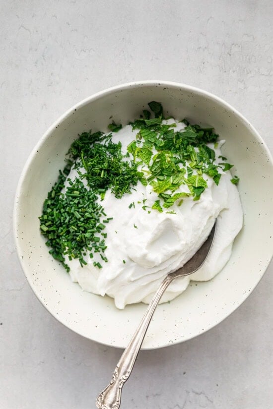 Add lemon and herbs.