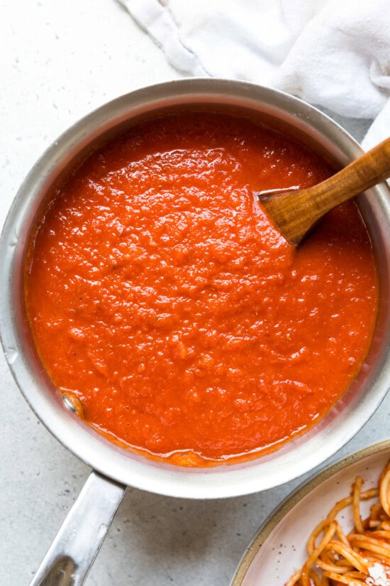 Close-up of rich, smooth tomato sauce showing velvety consistency