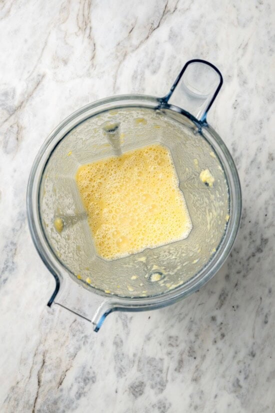 Pureed corn and broth in blender.