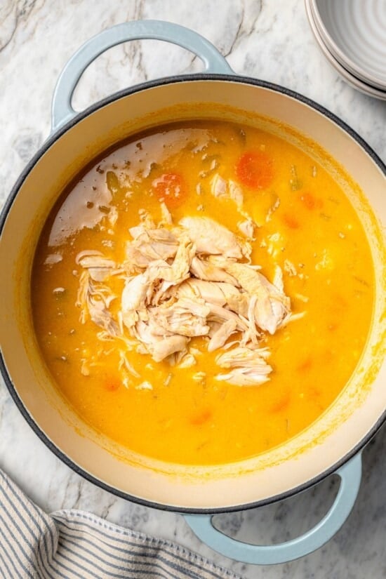 Chicken added to pot of corn chowder.