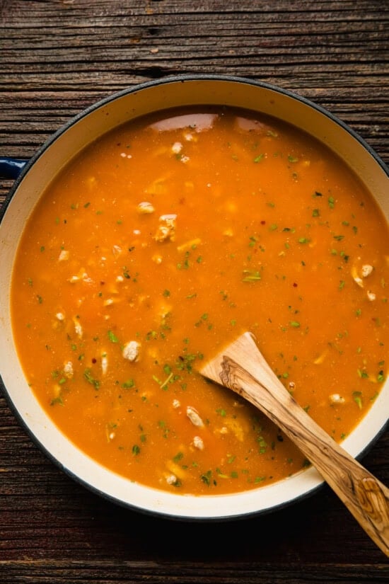 Add pumpkin and broth