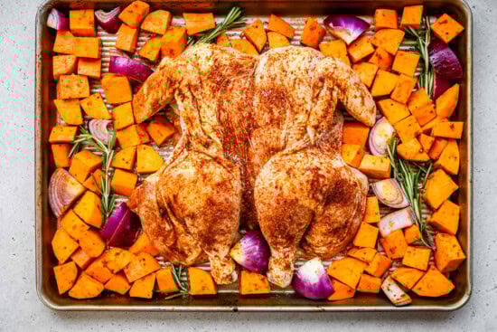 Spatchcock Chicken with Sweet Potatoes on a sheet pan