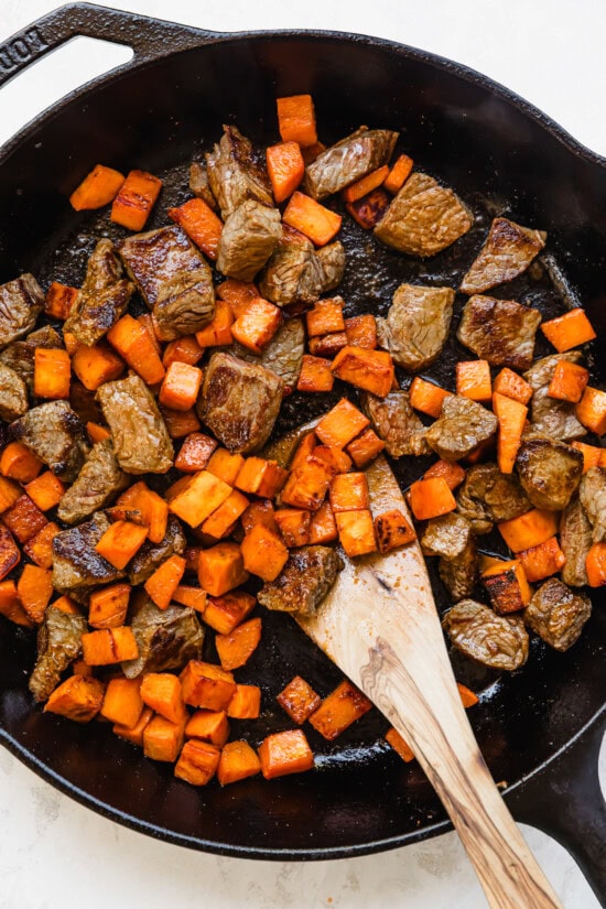 Return sweet potatoes to skillet