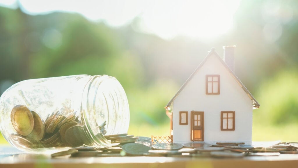 picture of a house and a jar of coins