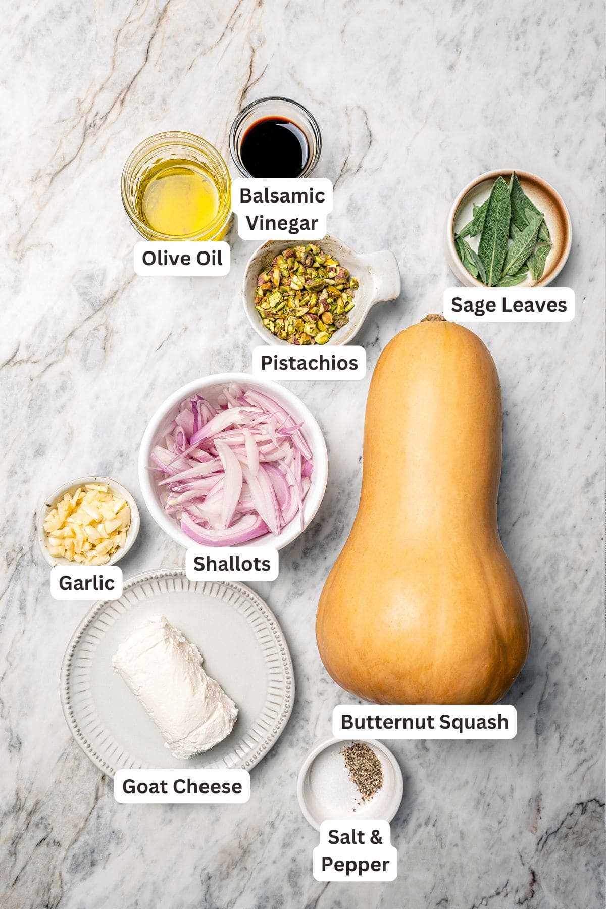 Ingredients for butternut squash bake with goat cheese and pistachios.