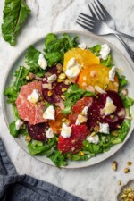 Roasted beet salad with citrus fruit, goat cheese, and pistachios.