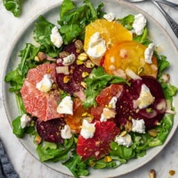 Roasted beet salad with citrus fruit, goat cheese, and pistachios.
