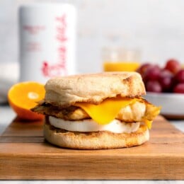 Copycat Chick-fil-A egg white grill sandwich on wood cutting board.